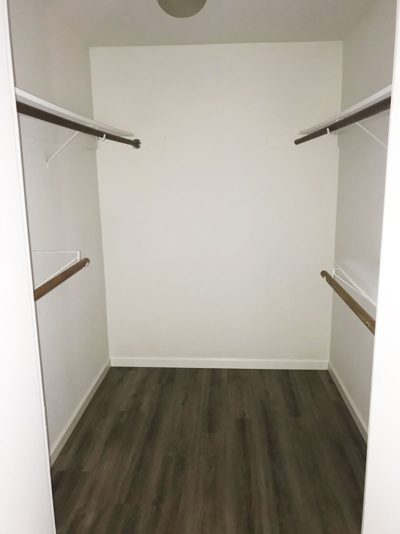 Walk-in closet in master bedroom.